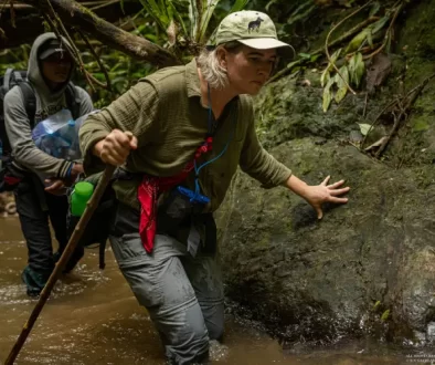 Aimee traveling through the Annamites with the Saola Foundation team along rivers and difficult terrain.