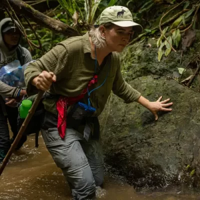 Aimee traveling through the Annamites with the Saola Foundation team along rivers and difficult terrain.